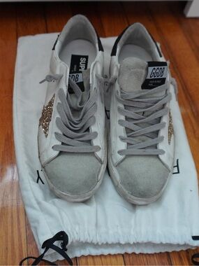 Golden Goose White Sneakers with Black Heel and Gold Star Accent